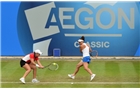 BIRMINGHAM, ENGLAND - JUNE 15:  Ashleigh Barty (L) and Casey Dellacqua of Australia in action during the Doubles Final during Day Seven of the Aegon Classic at Edgbaston Priory Club on June 15, 2014 in Birmingham, England.  (Photo by Tom Dulat/Getty Images)